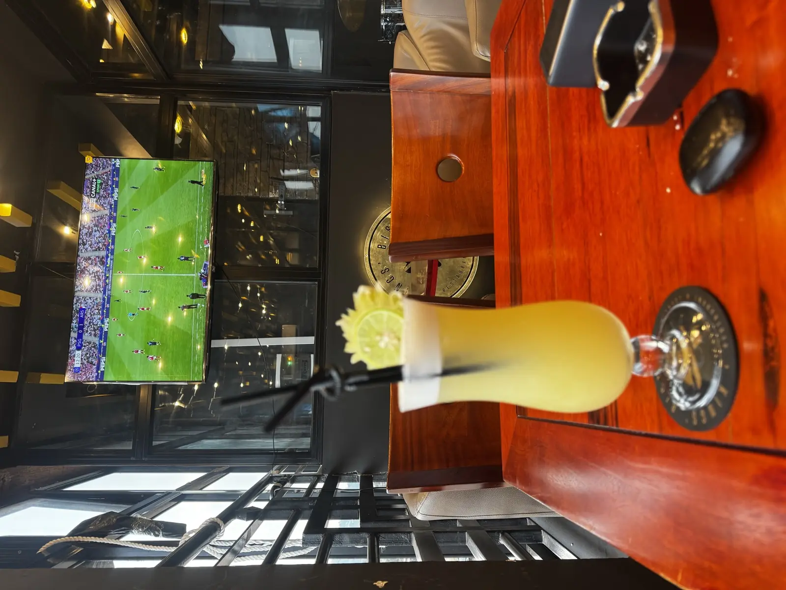A cocktail in front of the big screen