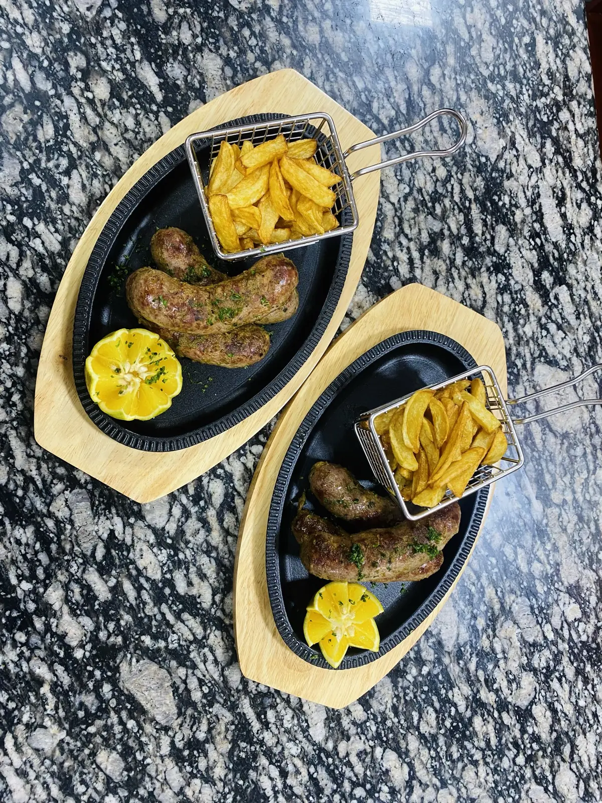Two grilled plates with plantain