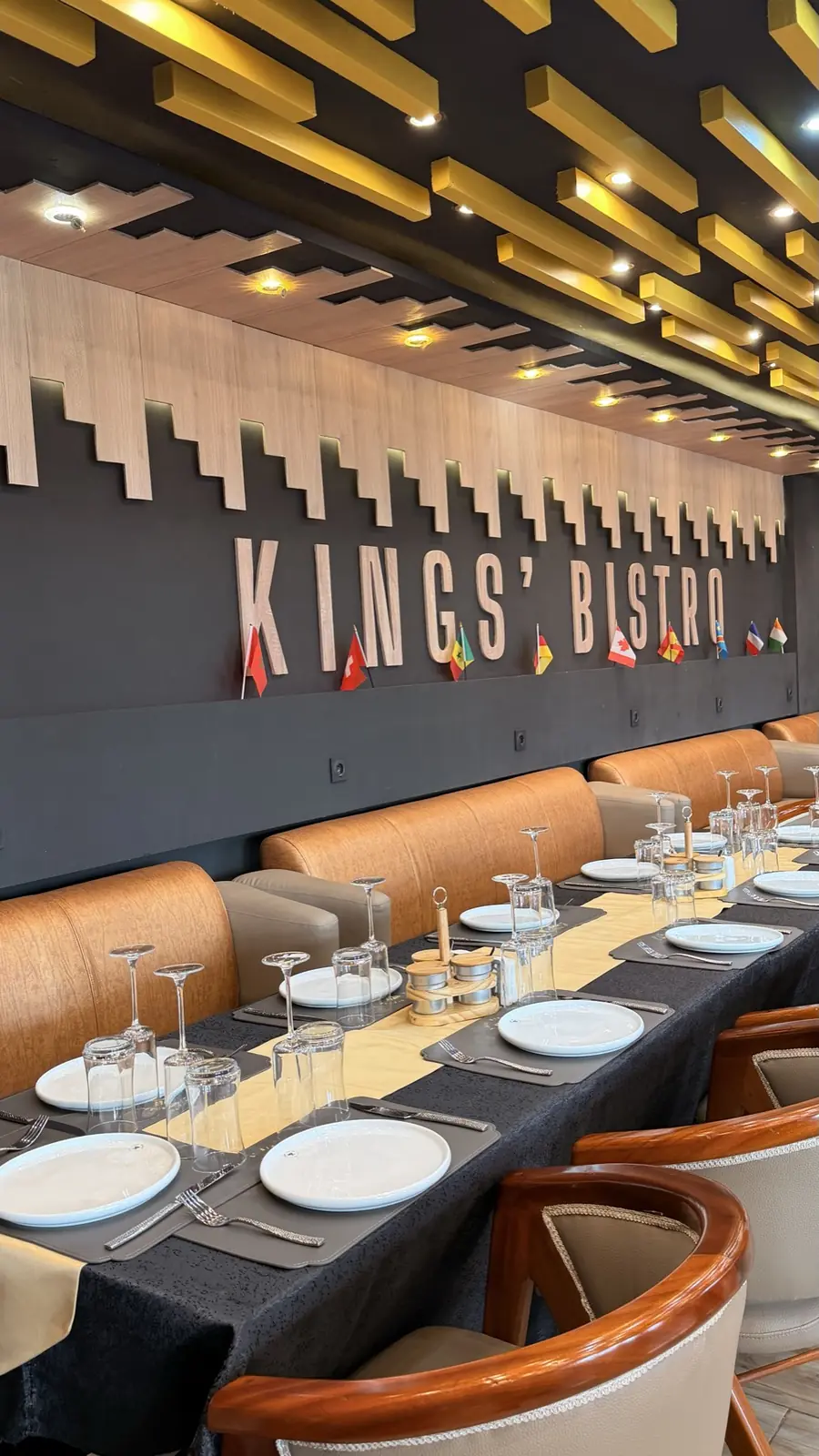 Kings' Bistro signage above the tables